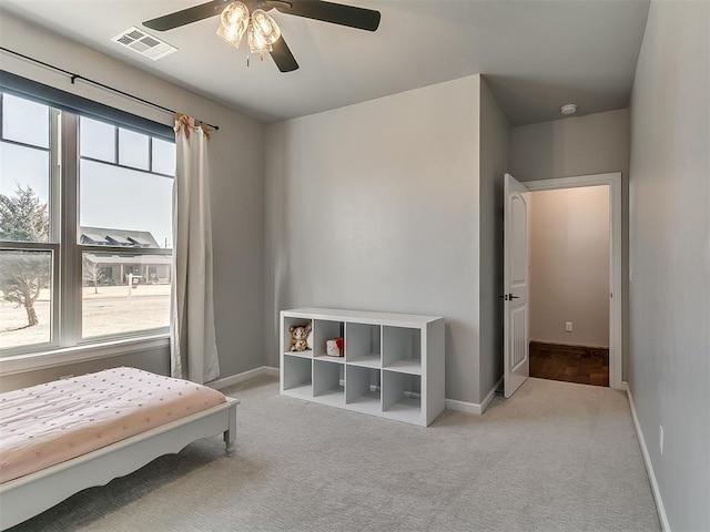3345 Red Ridge Dr, Blanchard, OK 73010 - bedroom featuring light colored carpet, baseboards, and a ceiling fan