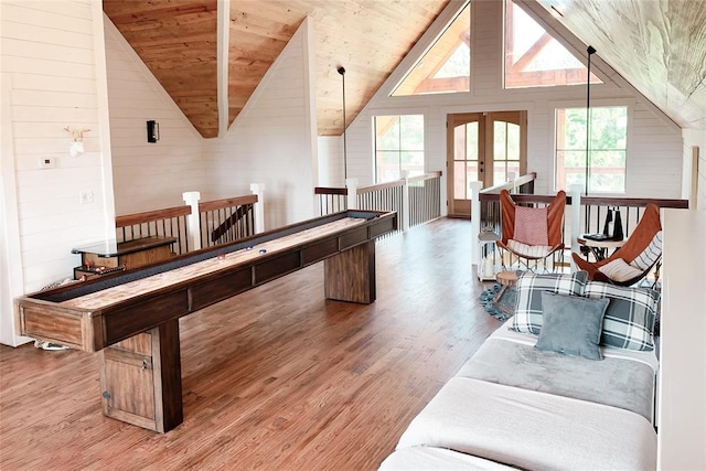 recreation room with lofted ceiling, wood ceiling, and light wood-style flooring
