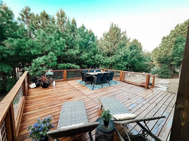 deck with outdoor dining area