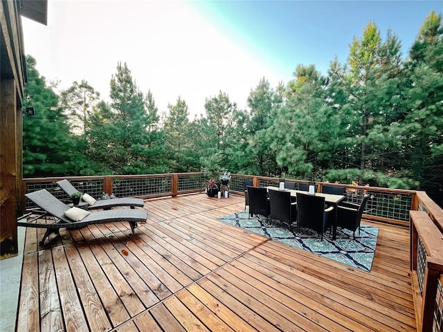 deck with outdoor dining area
