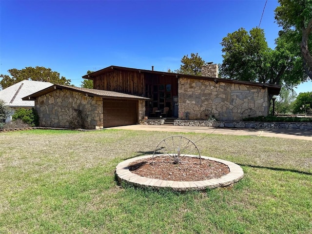 427 S Carnegie St, Carnegie, OK 73015 - exterior space with stone siding, a chimney, concrete driveway, an attached garage, and a yard