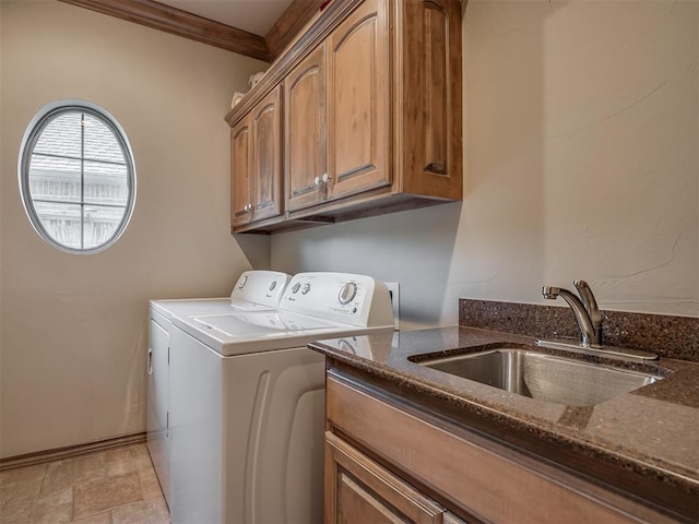 12304 N St Lukes Ln, Oklahoma City, OK 73142 - clothes washing area featuring washer and dryer, cabinet space, crown molding, light stone finish floors, and baseboards