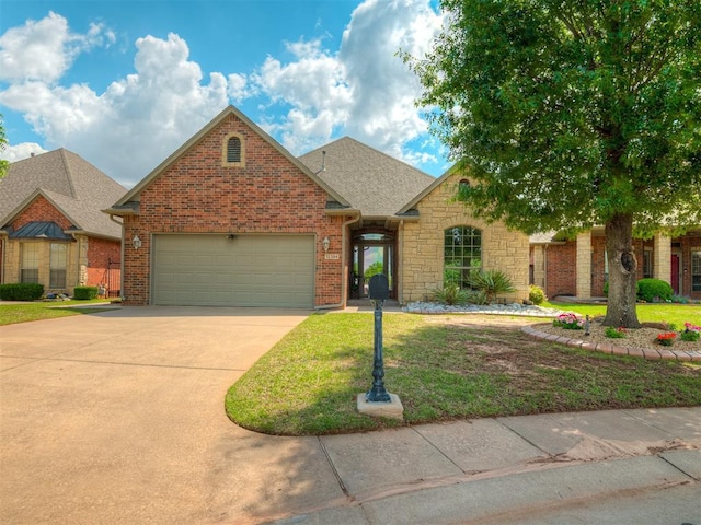 12304 N St Lukes Ln, Oklahoma City, OK 73142 - traditional home with an attached garage, driveway, brick siding, a front lawn, and a shingled roof
