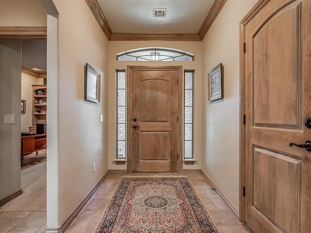 12304 N St Lukes Ln, Oklahoma City, OK 73142 - foyer entrance with ornamental molding, baseboards, stone tile floors, and arched walkways