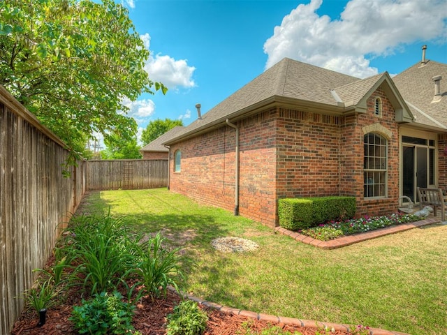 12304 N St Lukes Ln, Oklahoma City, OK 73142 - view of side of home featuring brick siding and a shingled roof