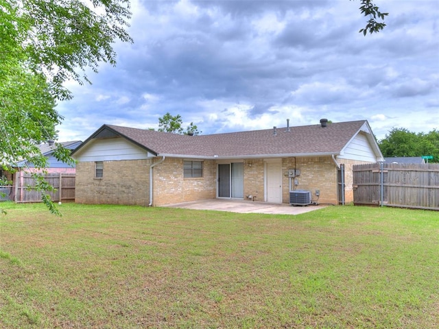 1703 Surrey Pl, Norman, OK 73071 - rear view of house featuring brick siding, a patio area, roof with shingles, and cooling unit