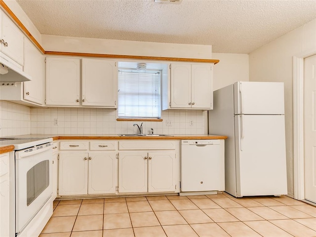 1703 Surrey Pl, Norman, OK 73071 - kitchen with white appliances, a sink, white cabinetry, backsplash, and a textured ceiling