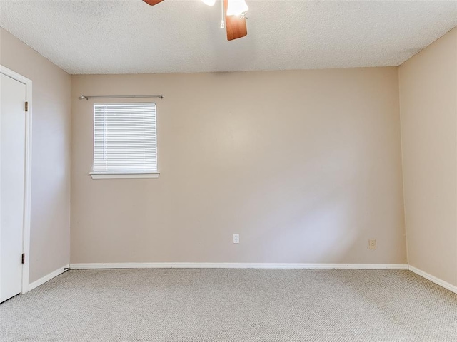 1703 Surrey Pl, Norman, OK 73071 - spare room with a ceiling fan, carpet, a textured ceiling, and baseboards