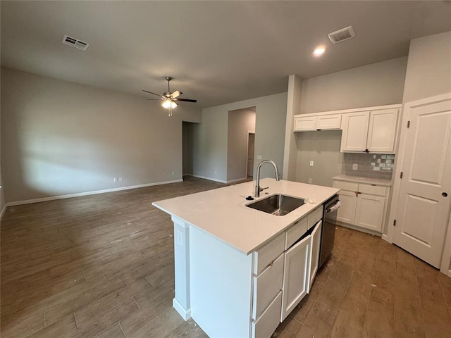 20640 Brush Creek Blvd, Harrah, OK 73045 - kitchen featuring wood finished floors, ceiling fan, white cabinets, and backsplash