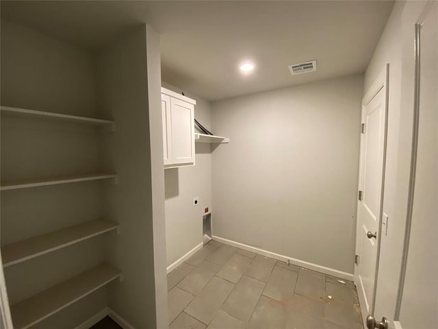 20640 Brush Creek Blvd, Harrah, OK 73045 - laundry room featuring hookup for an electric dryer, cabinet space, recessed lighting, and light tile patterned flooring