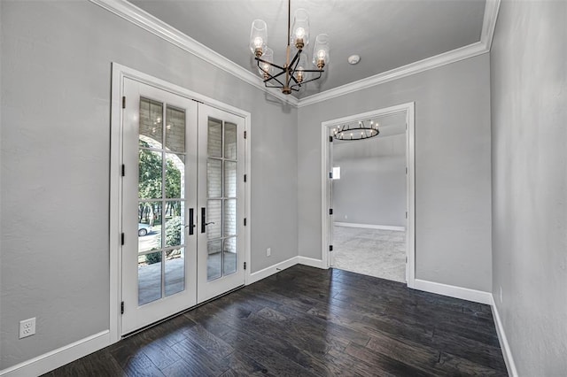 doorway to outside with crown molding, an inviting chandelier, french doors, and baseboards