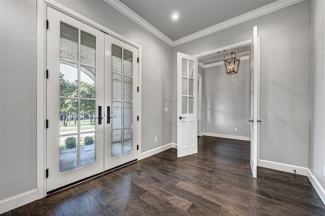 doorway with baseboards, ornamental molding, wood finished floors, and french doors