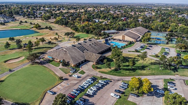 bird's eye view featuring a water view and view of golf course
