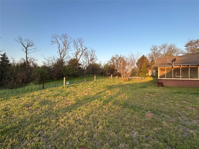 view of yard featuring a sunroom