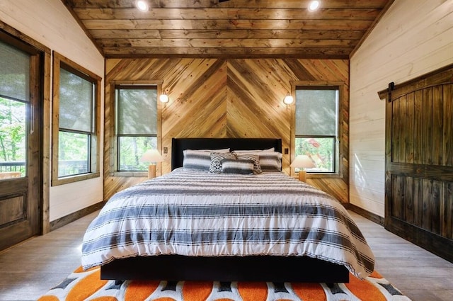 bedroom featuring wood walls, vaulted ceiling, and wooden ceiling