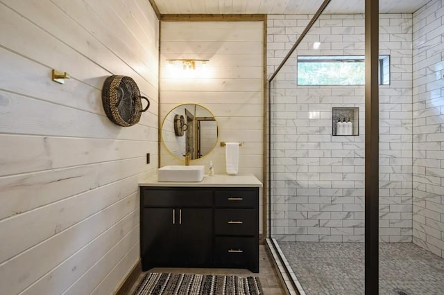 full bath featuring vanity and a shower stall