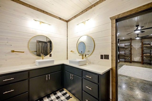 full bath with wooden walls and vanity