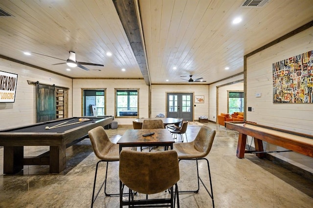 game room with concrete floors, wooden walls, a ceiling fan, and wood ceiling
