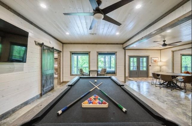 recreation room featuring a barn door, plenty of natural light, wood ceiling, ceiling fan, and recessed lighting