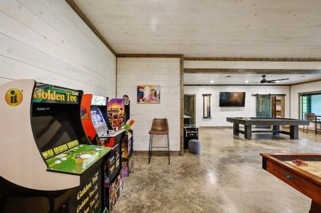 game room featuring a ceiling fan, concrete flooring, wood walls, and billiards