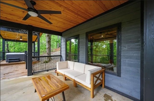 sunroom / solarium featuring a hot tub