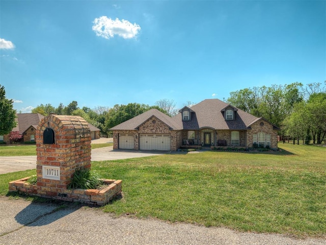 10711 Crystal Creek Dr, Mustang, OK 73064 - view of front facade with a garage, a front lawn, and concrete driveway