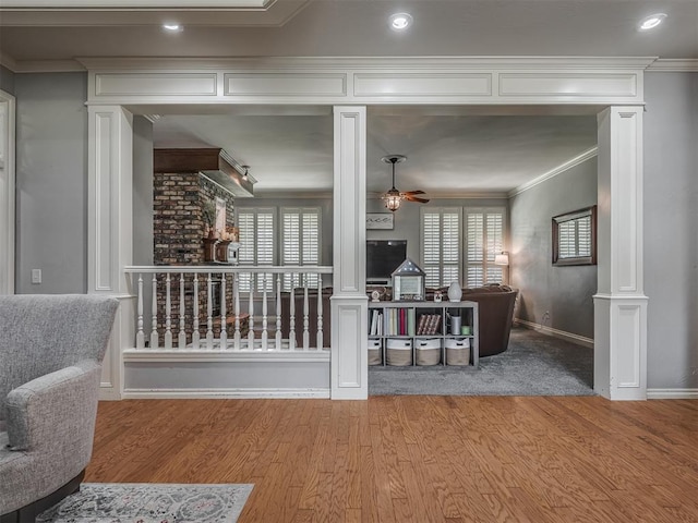 10711 Crystal Creek Dr, Mustang, OK 73064 - interior space with baseboards, wood finished floors, ornate columns, and ceiling fan