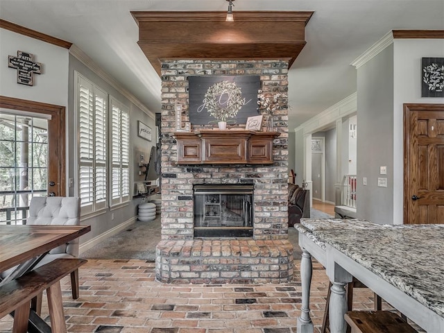 10711 Crystal Creek Dr, Mustang, OK 73064 - living area featuring baseboards, ornamental molding, brick floor, and a fireplace