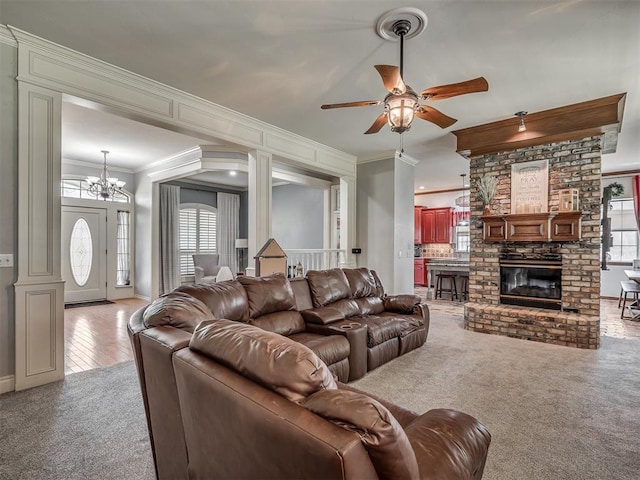 10711 Crystal Creek Dr, Mustang, OK 73064 - living room with a wealth of natural light, carpet floors, ornamental molding, and ceiling fan with notable chandelier