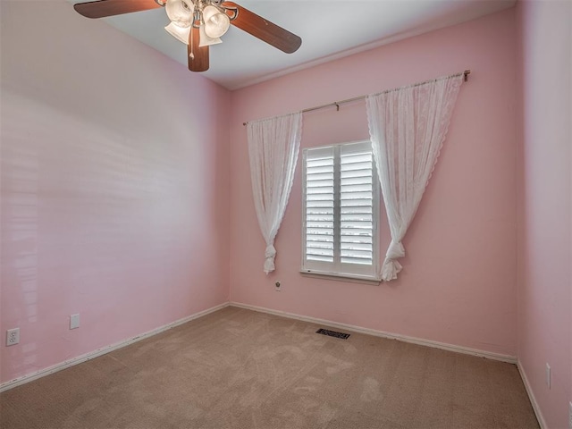10711 Crystal Creek Dr, Mustang, OK 73064 - carpeted empty room featuring visible vents, baseboards, and ceiling fan