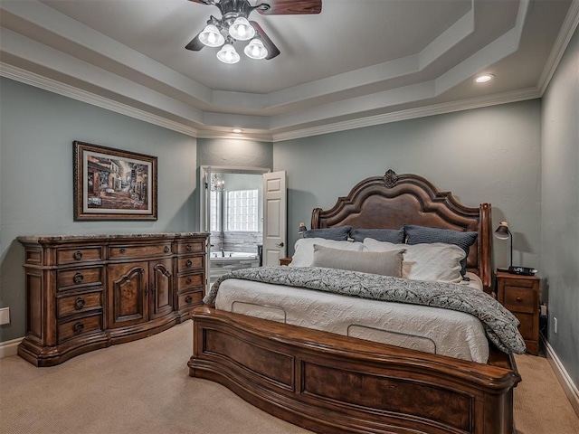 10711 Crystal Creek Dr, Mustang, OK 73064 - bedroom with ceiling fan, a tray ceiling, light colored carpet, baseboards, and ornamental molding