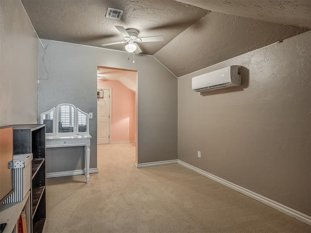 10711 Crystal Creek Dr, Mustang, OK 73064 - additional living space with an AC wall unit, vaulted ceiling, a textured ceiling, ceiling fan, and light carpet