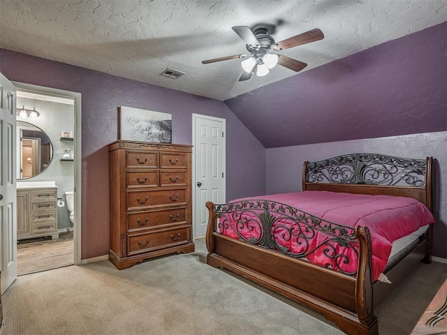 10711 Crystal Creek Dr, Mustang, OK 73064 - bedroom with vaulted ceiling, visible vents, a textured wall, carpet floors, and a textured ceiling
