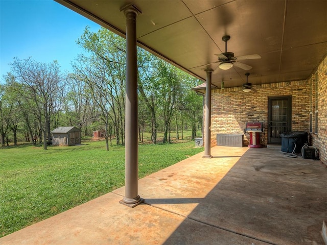 10711 Crystal Creek Dr, Mustang, OK 73064 - view of patio / terrace featuring an outdoor structure, a storage shed, and ceiling fan