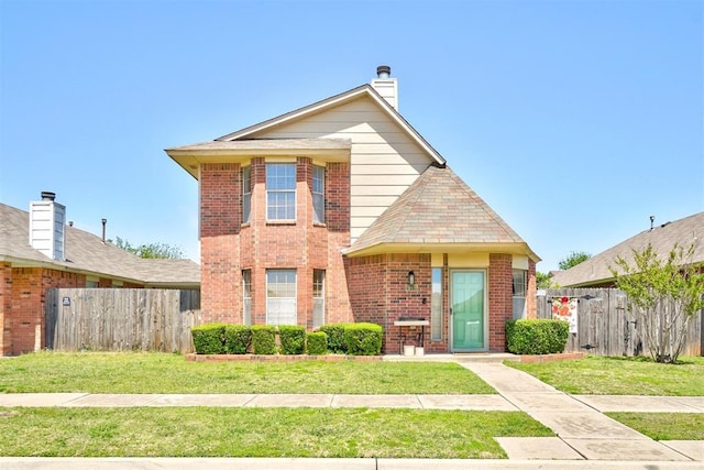 1409 SW 23rd St, Moore, OK 73170 - traditional-style home with brick siding, a front yard, and fence