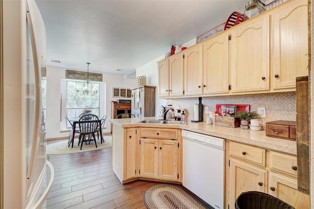 1409 SW 23rd St, Moore, OK 73170 - kitchen with white appliances, a sink, and light brown cabinetry