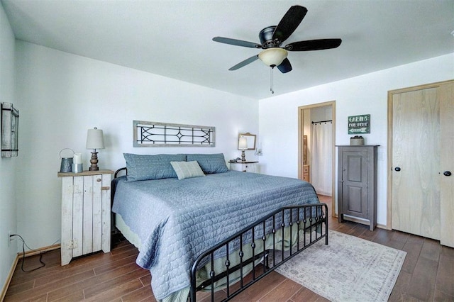 1409 SW 23rd St, Moore, OK 73170 - bedroom featuring baseboards, a ceiling fan, and wood finished floors