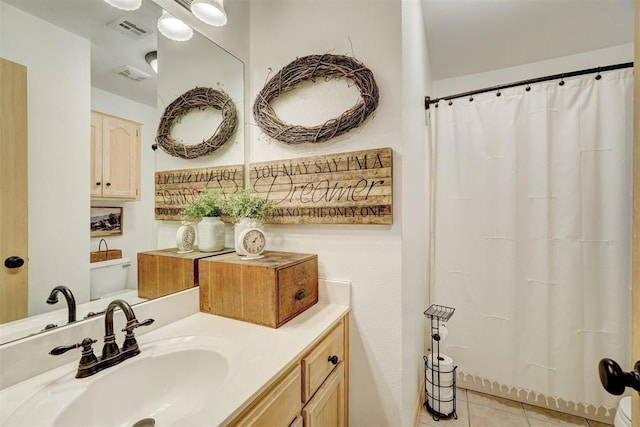 1409 SW 23rd St, Moore, OK 73170 - bathroom with visible vents, tile patterned flooring, and vanity