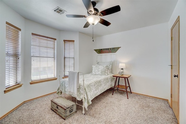 1409 SW 23rd St, Moore, OK 73170 - bedroom featuring baseboards, visible vents, carpet, and ceiling fan