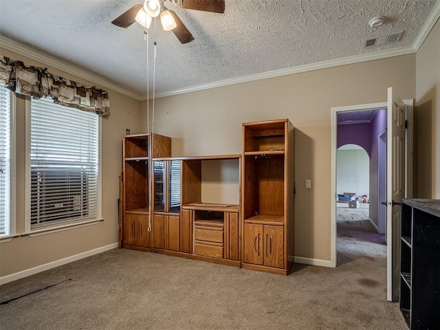 4124 E Horseshoe Ln, Moore, OK 73160 - unfurnished bedroom featuring visible vents, carpet flooring, a textured ceiling, and crown molding