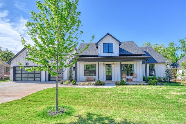 modern farmhouse style home with board and batten siding, a porch, driveway, roof with shingles, and a front lawn