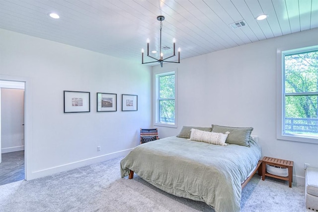 bedroom featuring visible vents, a notable chandelier, carpet, and recessed lighting