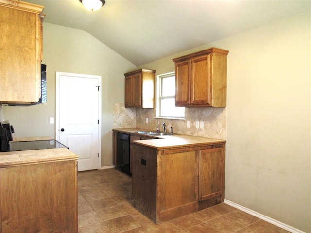 kitchen with electric range, tasteful backsplash, vaulted ceiling, dishwasher, and a sink