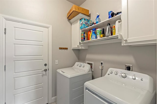laundry area featuring cabinet space and separate washer and dryer