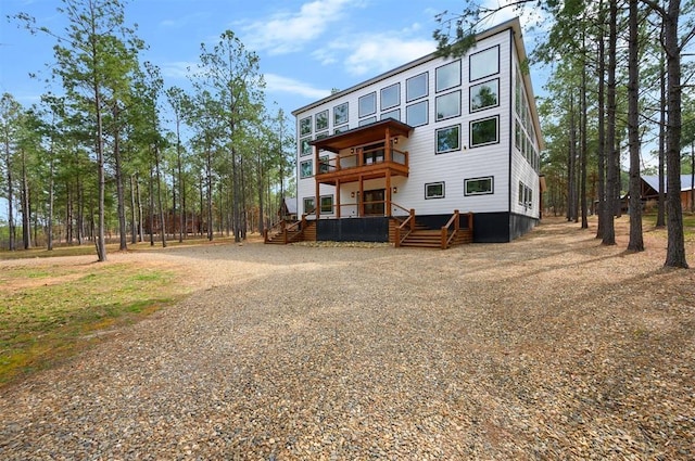 back of house with a balcony