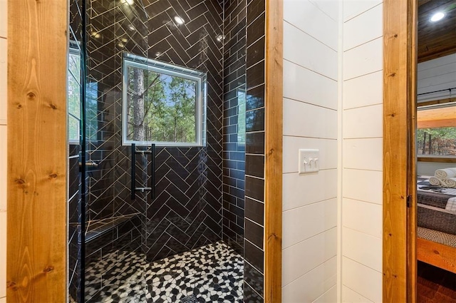 full bath with a tile shower