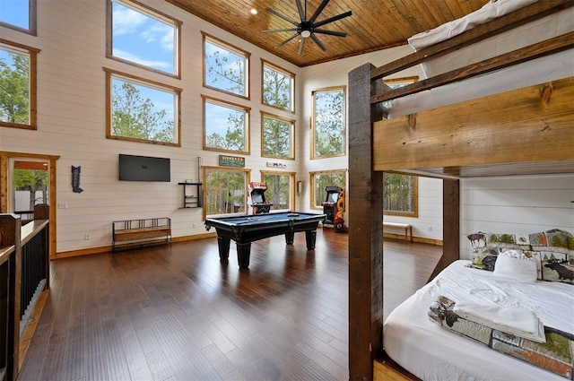 game room featuring wooden walls, a high ceiling, a ceiling fan, pool table, and wooden ceiling