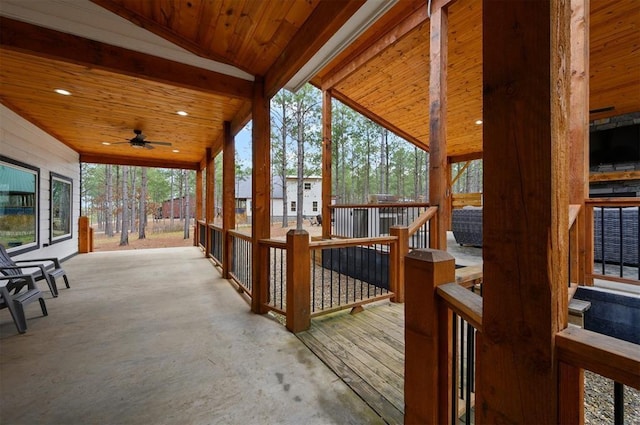 wooden terrace featuring a ceiling fan