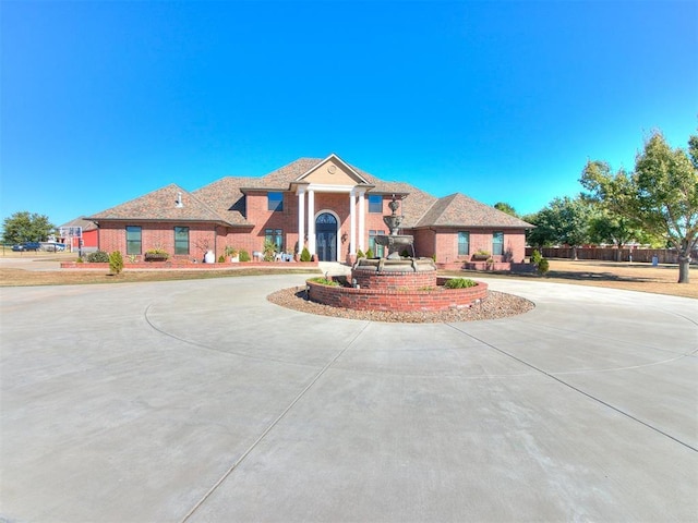 6363 NW 220th St, Edmond, OK 73025 - view of front of property featuring brick siding and curved driveway