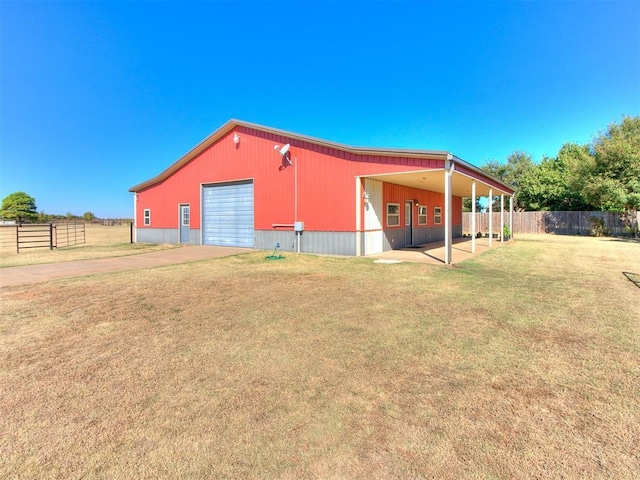 6363 NW 220th St, Edmond, OK 73025 - view of pole building with fence, a lawn, and driveway
